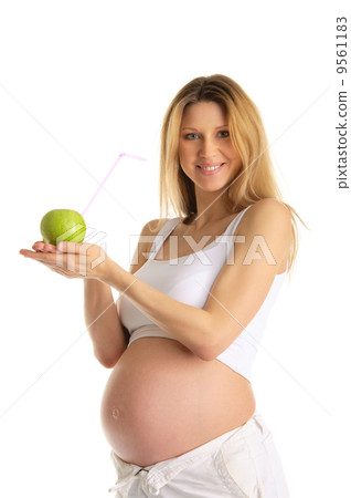 pregnant woman holding an apple with a straw pregnant woman holding an apple with a straw 9561183