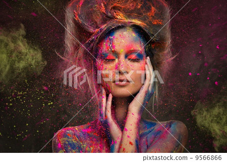 Young woman muse with creative body art and hairdo Young woman muse with creative body art and hairdo 9566866