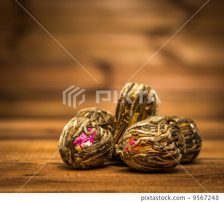 Flower tea close-up over wooden background Flower tea close-up over wooden background 9567248