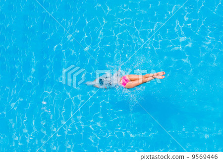 Top view of a girl diving in the pool 9569446