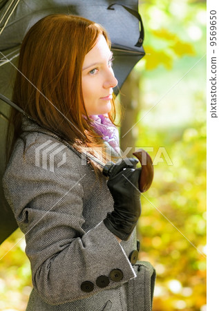 Young woman in autumn park. Young woman in autumn park. 9569650