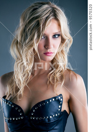 Portrait of charming young girl in leather corset Portrait of charming young girl in leather corset 9570320