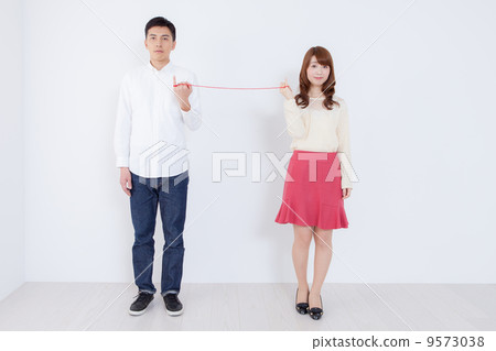 Two people connected by red thread 9573038