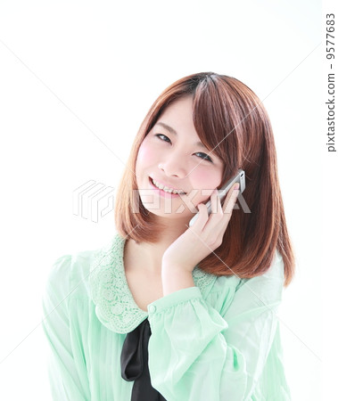 Woman using a smartphone Woman using a smartphone 9577683