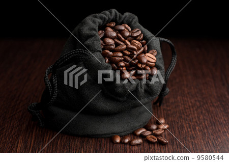 Coffe beans in bag on black 9580544