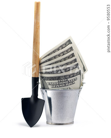 Bucket with dollars and shovel isolated on white 9580553