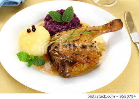 Duck leg with potato dumplings, red cabbage and gravy Duck leg with potato dumplings, red cabbage and gravy 9580794