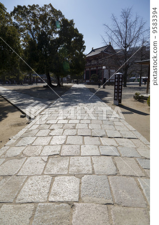 The stone pavement and the paradise gate in the Shitennoji temple The stone pavement and the paradise gate in the Shitennoji temple 9583394