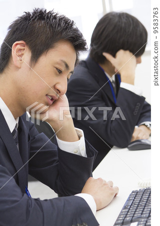Tired office worker Tired office worker 9583763