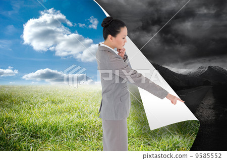 Composite image of thoughtful asian businesswoman pointing Composite image of thoughtful asian businesswoman pointing 9585552