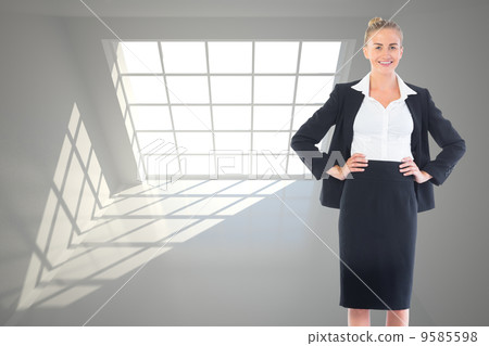 Composite image of businesswoman standing with hands on hips Composite image of businesswoman standing with hands on hips 9585598