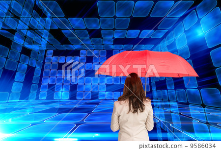 Composite image of businesswoman standing back to camera holding Composite image of businesswoman standing back to camera holding 9586034