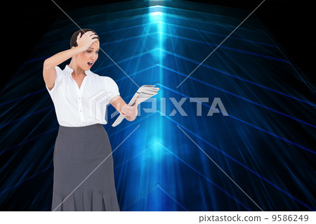 Composite image of surprised classy businesswoman holding newspa 9586249