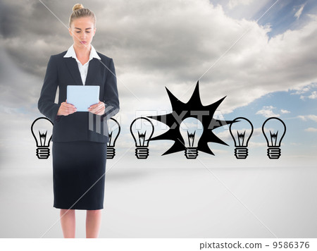 Composite image of businesswoman holding new tablet Composite image of businesswoman holding new tablet 9586376