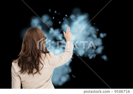 Composite image of brunette businesswoman standing back to camer 9586716