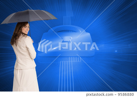 Composite image of rear view of classy businesswoman holding umb 9586880