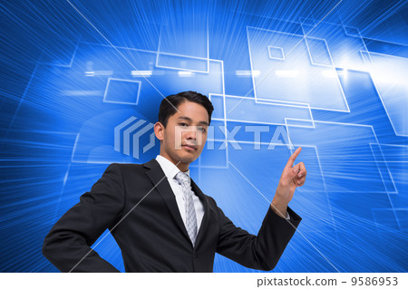 Composite image of unsmiling asian businessman pointing 9586953