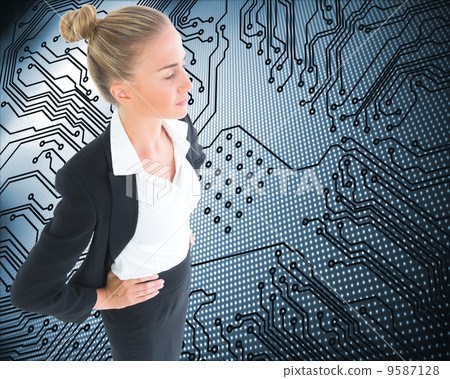 Composite image of businesswoman standing with hands on hips 9587128