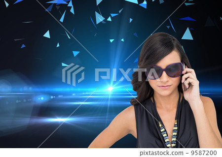 Composite image of serious elegant brunette wearing sunglasses o Composite image of serious elegant brunette wearing sunglasses o 9587200