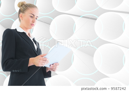 Composite image of businesswoman holding tablet Composite image of businesswoman holding tablet 9587242