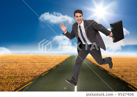 Composite image of smiling businessman in a hury Composite image of smiling businessman in a hury 9587406