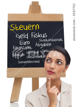 Composite image of smiling businesswoman thinking 9587702