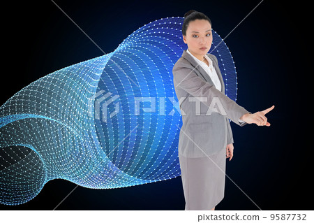 Composite image of unsmiling asian businesswoman pointing Composite image of unsmiling asian businesswoman pointing 9587732