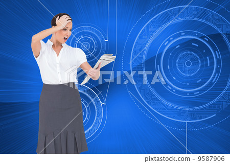 Composite image of surprised classy businesswoman holding newspa 9587906