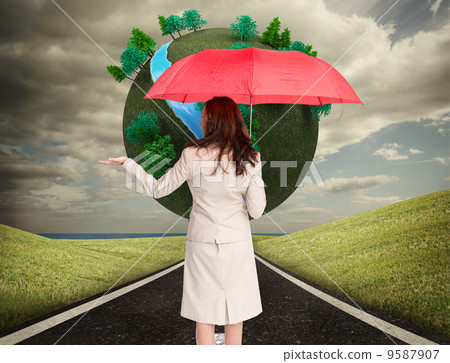 Composite image of businesswoman holding umbrella 9587907