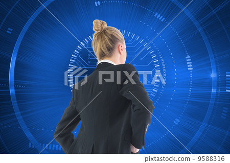 Composite image of businesswoman standing with hands on hips Composite image of businesswoman standing with hands on hips 9588316
