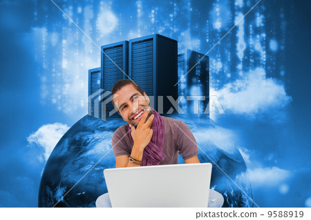 Composite image of thinking man sitting on floor using laptop an Composite image of thinking man sitting on floor using laptop an 9588919