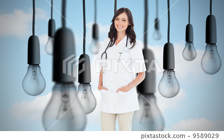 Composite image of confident and smiling woman doctor standing i Composite image of confident and smiling woman doctor standing i 9589029