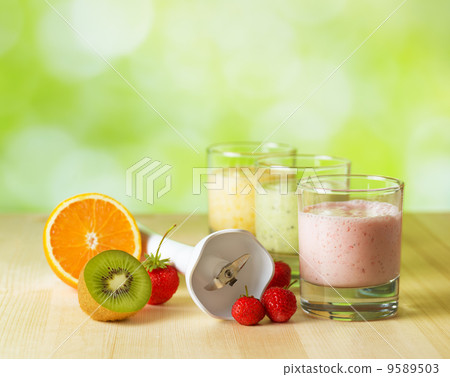 Fruit smoothie on wooden table on narural background Fruit smoothie on wooden table on narural background 9589503