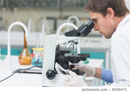 Scientific researcher using microscope in the laboratory 9590471