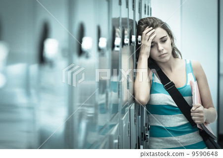 Wincing pretty student having a headache Wincing pretty student having a headache 9590648