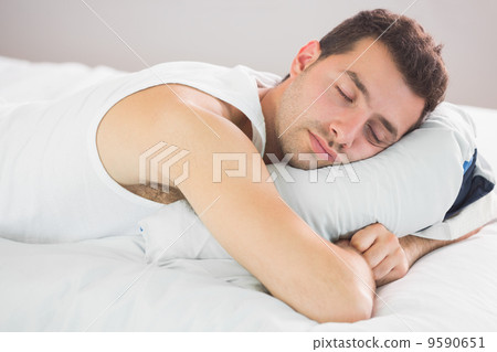Calm handsome man sleeping 9590651
