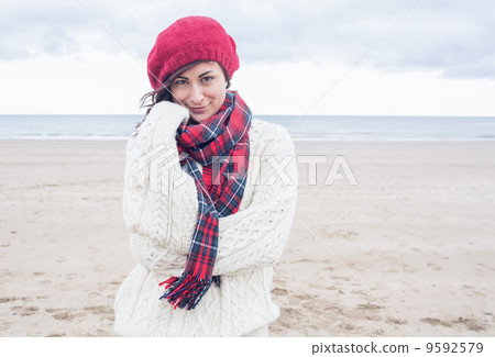Cute smiling young woman in stylish warm clothing 9592579