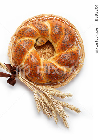 A fresh loaf of bread sprinkle with poppy seeds isolated on whit A fresh loaf of bread sprinkle with poppy seeds isolated on whit 9593204