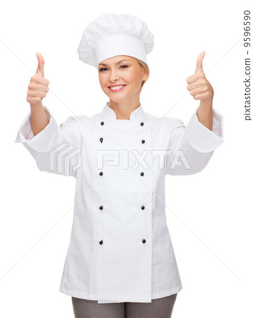 smiling female chef showing thumbs up smiling female chef showing thumbs up 9596590