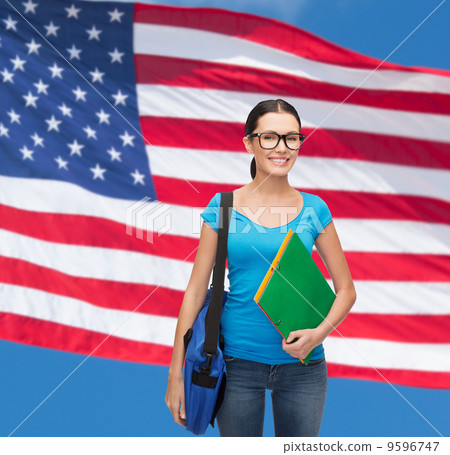smiling student with bag and folders smiling student with bag and folders 9596747