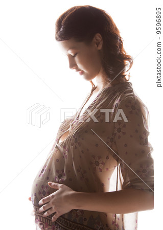 silhouette picture of pregnant beautiful woman silhouette picture of pregnant beautiful woman 9596895