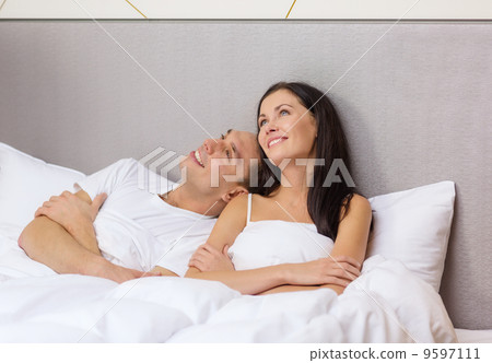 happy couple dreaming in bed happy couple dreaming in bed 9597111