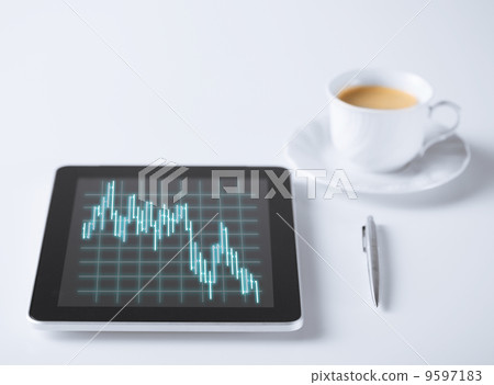 tablet pc with forex chart on it and cup of coffee tablet pc with forex chart on it and cup of coffee 9597183