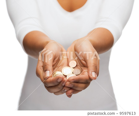 womans cupped hands showing euro coins 9597613