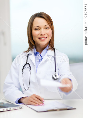 smiling doctor with laptop computer and clipboard smiling doctor with laptop computer and clipboard 9597674