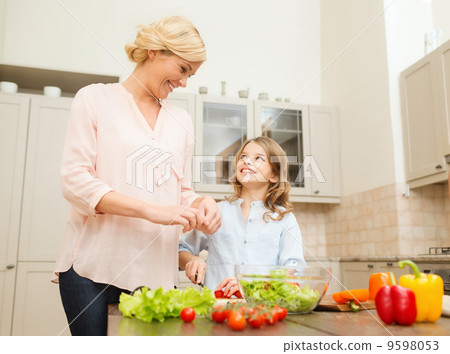 happy family making dinner in kitchen happy family making dinner in kitchen 9598053