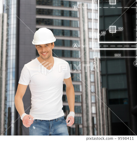 handsome builder in white helmet handsome builder in white helmet 9598411