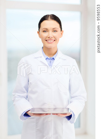 smiling young doctor with tablet pc in cabinet 9598553