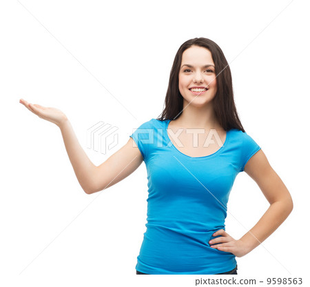 teenager holding something on the palm of her hand 9598563