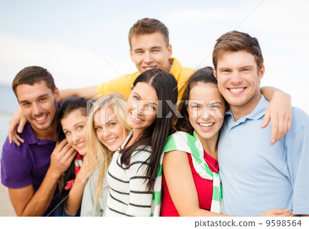 group of friends having fun on the beach 9598564